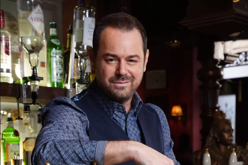 Danny Dyer as Mick Carter in EastEnders, pictured behind the bar in the Queen Vic pub