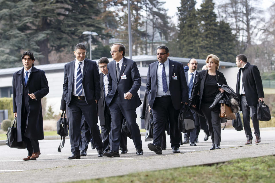 Syrian opposition chief negotiator Hadi Bahra, front 3rd from left, returns with his delegation after a break of the meeting, at the European headquarters of the United Nations, in Geneva, Switzerland, Saturday, Jan. 25, 2014. Two Syrian delegations, representatives of Syrian President Bashar Assad and Syrian opposition, are meeting together with the Joint Special Representative.(AP Photo/Keystone,Salvatore Di Nolfi)