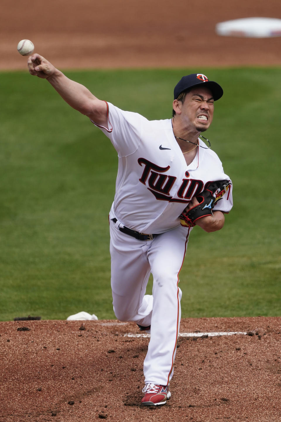 Minnesota Twins starting pitcher Kenta Maeda (18) works in the first inning of a spring training baseball game against the Boston Red Sox Sunday, March 14, 2021, in Fort Myers, Fla.. (AP Photo/John Bazemore)