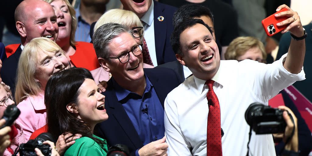 east kilbride, scotland july 3 labour leader sir keir starmer c and scottish labour leader anas sarwar r take a selfie as they attend a campaign event at caledonian gladiators stadium on july 3, 2024 in east kilbride, scotland photo by jeff j mitchellgetty images