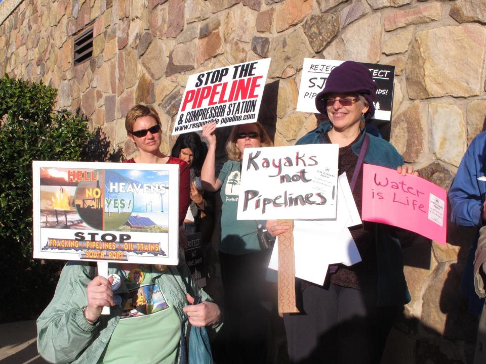 Opponents of a proposed natural gas line that would run through New Jersey's federally protected Pinelands reserve gather outside a hotel in Cherry Hill N.J., Friday Feb. 24, 2017 before a Pinelands Commission meeting at which the proposal was to be voted on. The pipeline has become one of the most hotly contested jobs vs. environment clashes in recent New Jersey history. (AP Photo/Wayne Parry)