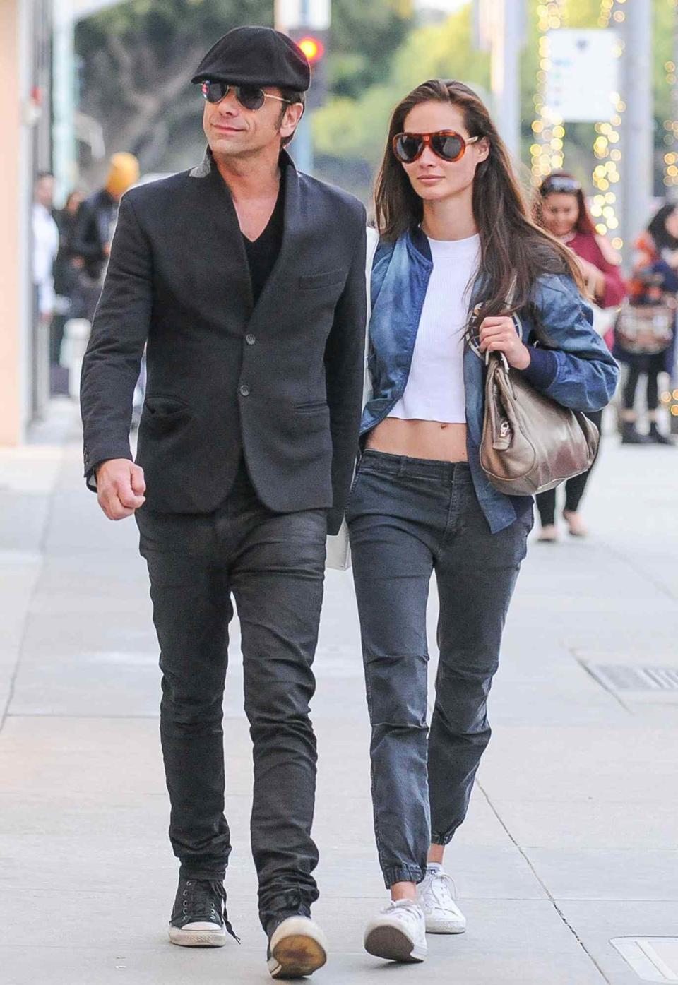 John Stamos is seen with his girlfriend Caitlin McHugh on December 07, 2016 in Los Angeles, California