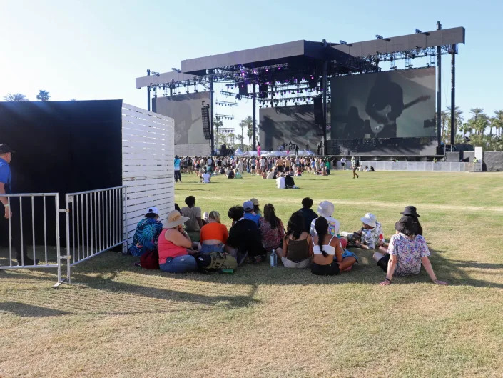 coachella 2022 people sitting in the shade