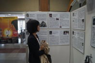 <p>A Japanese woman reads about North Korea abduction victims at a display in the lobby for the Ministry of Foreign Affairs in Tokyo. (Photo: Michael Walsh/Yahoo News) </p>