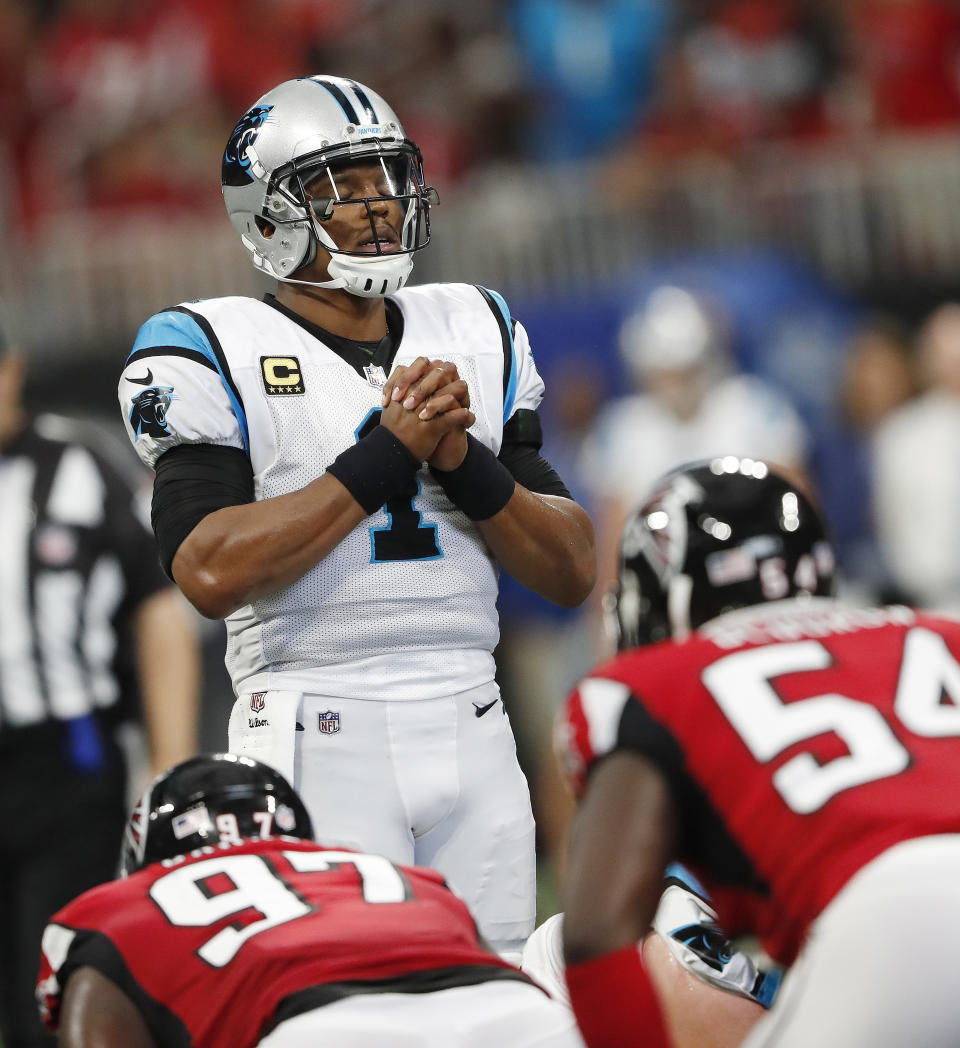 Carolina Panthers quarterback Cam Newton (1) pauses before a play against the Atlanta Falcons during the first half of an NFL football game, Sunday, Sept. 16, 2018, in Atlanta. (AP Photo/John Bazemore)