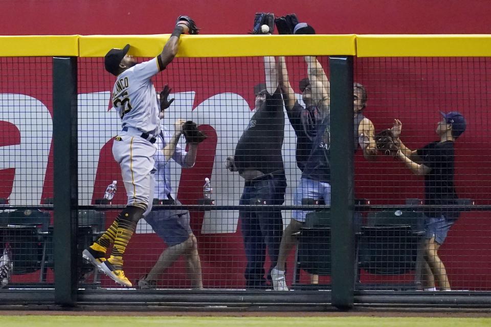 Pittsburgh Pirates right fielder Gregory Polanco is unable to make a catch on a home run hit by Arizona Diamondbacks' Daulton Varsho during the seventh inning of a baseball game, Wednesday, July 21, 2021, in Phoenix. The Diamondbacks won 6-4. (AP Photo/Ross D. Franklin)