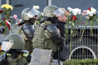 Police detain an opposition supporter protesting the election results as protesters encountered aggressive police tactics in the capital of Minsk, Belarus, Tuesday, Aug. 11, 2020. Heavy police cordons blocking Minsk's central squares and avenues didn't discourage the demonstrators who again took to the streets chanting "Shame!" and "Long live Belarus!" Police moved quickly Tuesday to separate and disperse scattered groups of protesters in the capital, but new pockets of resistance kept mushrooming across downtown Minsk. (AP Photo)