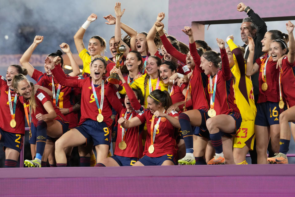 Spain players celebrate with the trophy at the end of the Women's World Cup soccer final between Spain and England at Stadium Australia in Sydney, Australia, Sunday, Aug. 20, 2023. Spain won 1-0. (AP Photo/Abbie Parr)