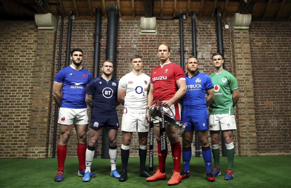 Team captains pose for a photo with the Six Nations Trophy, left to right, France's Charles Ollivon, Scotland's Stuart Hogg, England's Owen Farrell, Wales' Alun Wyn Jones, Italy's Luca Bigi and Ireland's Jonathan Sexton during the Six Nations launch in London, Wednesday Jan. 22, 2020. (Steven Paston/PA via AP)