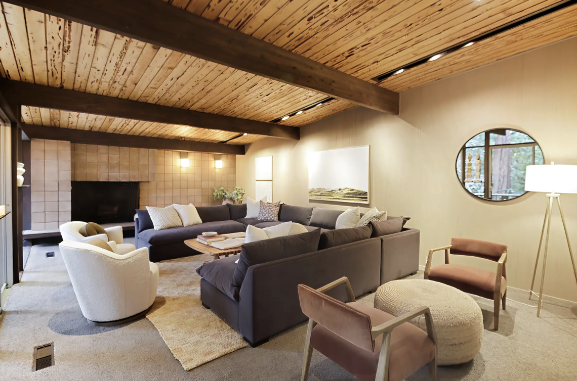 The classic mid-century modern sunken living room with fireplace. TopNotch360 via Peter Rice