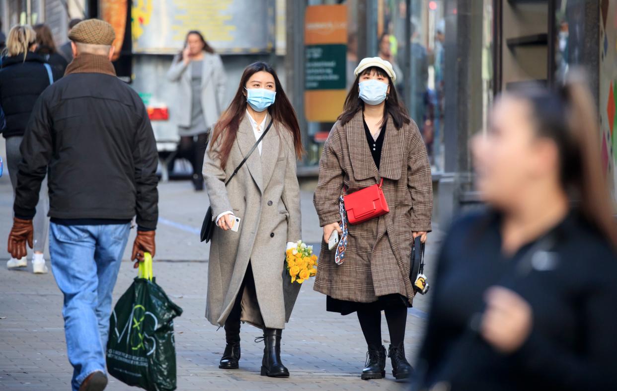 <p>People in Leeds, Yorkshire, which will enter Tier 3, after the four-week national lockdown to curb the spread of coronavirus.</p> (PA)