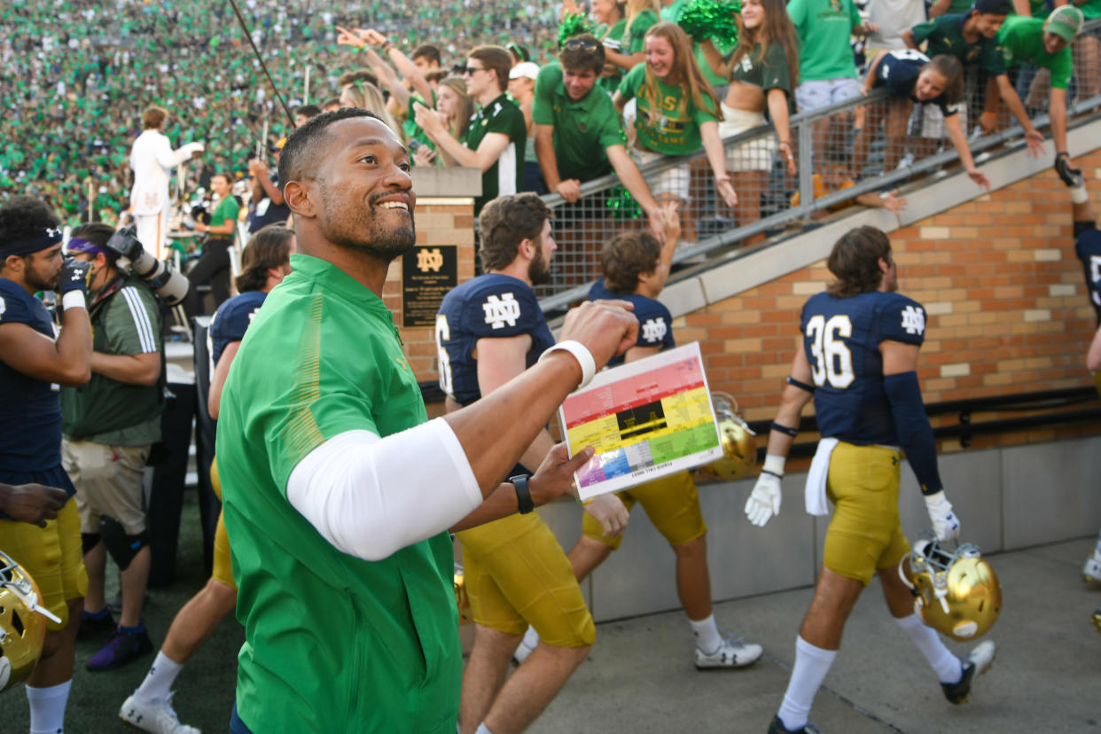 Sep 18, 2021; South Bend, Indiana, USA; Notre Dame Fighting Irish defensive coordinator Marcus Freeman leaves the field after Notre Dame defeated the Purdue Boilermakers at Notre Dame Stadium. Mandatory Credit: Matt Cashore-USA TODAY Sports