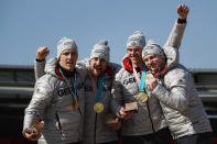 <p>Gold medalists Francesco Friedrich, Candy Bauer, Martin Grothkopp and Thorsten Margis of Germany celebrate on the podium during the medal ceremony after the 4-man Boblseigh Heats on day sixteen of the PyeongChang 2018 Winter Olympic Games at Olympic Sliding Centre on February 25, 2018 in Pyeongchang-gun, South Korea. (Photo by Clive Mason/Getty Images) </p>