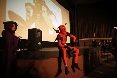 Participants wear costumes during the Cuban Otaku festival at a cinema in Havana, Cuba, July 24, 2016. REUTERS/Alexandre Meneghini