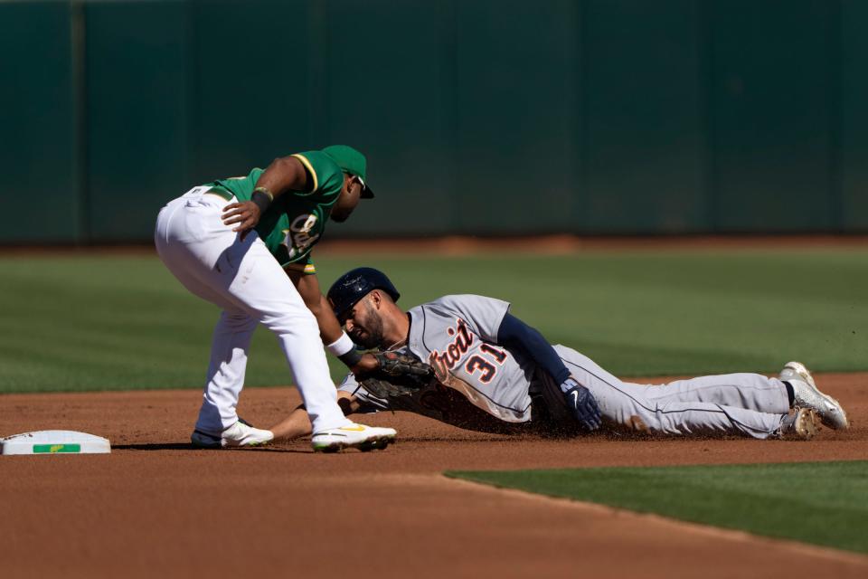 Oakland Athletics shortstop Elvis Andrus (17) tags out Detroit Tigers center fielder Riley Greene (31) during the first inning at RingCentral Coliseum.