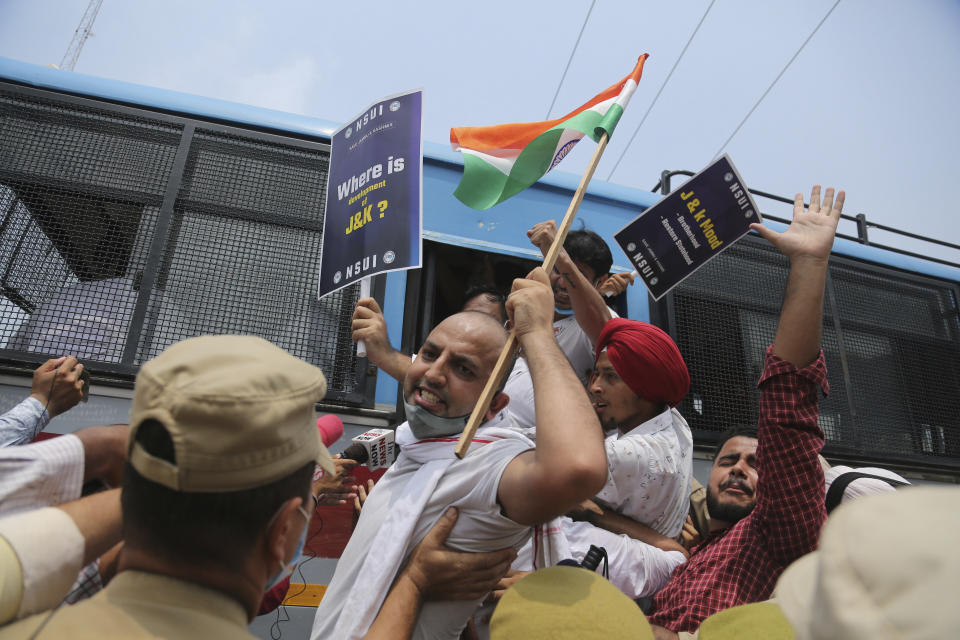 Members of National Students' Union of India (NSUI) are being detained and taken away by police during protest marking the second anniversary of Indian government scrapping Kashmir’s semi- autonomy in Jammu, India, Thursday, Aug. 5, 2021. On Aug. 5, 2019, Indian government passed legislation in Parliament that stripped Jammu and Kashmir’s statehood, scrapped its separate constitution and removed inherited protections on land and jobs. (AP Photo/Channi Anand)