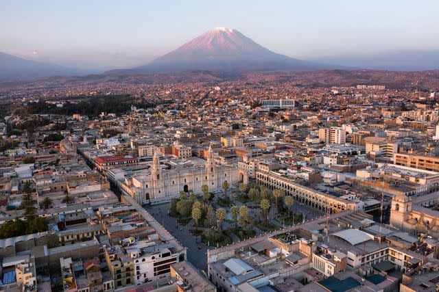 <p>Pierre Lepretre/Getty Images</p> The city of Arequipa, with the Misti Volcano in the distance.