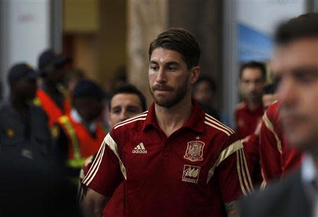 Spain's Sergio Ramos arrives at the O. R. Tambo International Airport, ahead of Tuesday's international friendly soccer match against South Africa at Soccer City, in Johannesburg, November 17, 2013. REUTERS/Siphiwe Sibeko