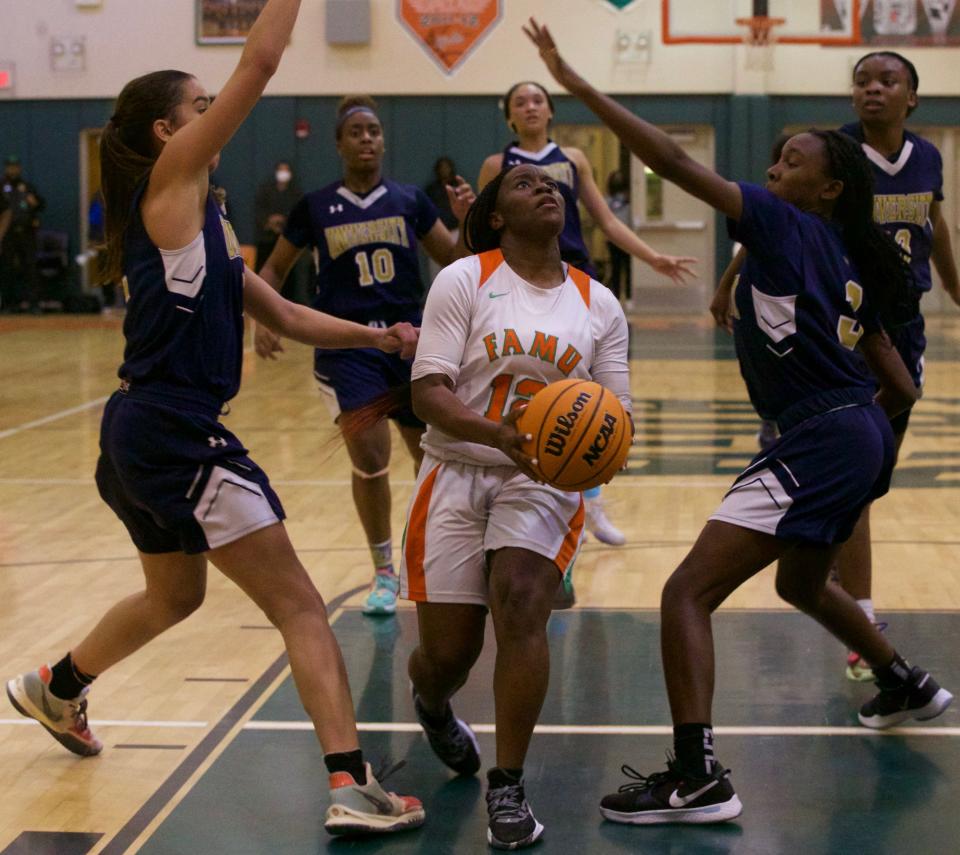 FAMU DRS sophomore guard Jaila Young (12) attempts to shoot the ball in the Class 2A Region 1 championship against University Christian on Feb. 18, 2022 at FAMU DRS. The Rattlers lost, 55-53.