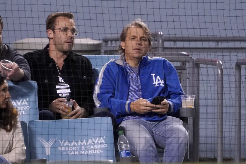 Los Angeles Dodgers co-owner Todd Boehly, right, is seen during a baseball game.