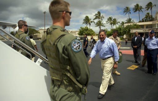 US Secretary of Defense Leon Panetta (centre) boards his plane at Hickam Air force Base in Honolulu, Hawaii. The United States will shift the majority of its naval fleet to the Pacific by 2020 as part of a new strategic focus on Asia, Pentagon chief Leon Panetta has told a summit in Singapore