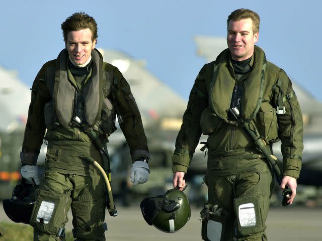 <p>David Cheskin - PA Images/PA Images/Getty</p> Ewan McGregor and Colin McGregor after taking to the skies over Scotland in an RAF Tornado jet.