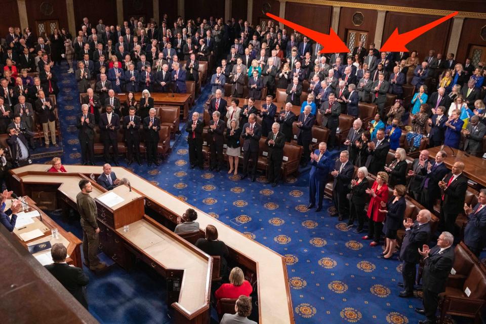 Reps. Lauren Boebert and Matt Gaetz stand as lawmakers give Ukrainian President Volodymyr Zelenskyy a standing ovation on Wednesday.