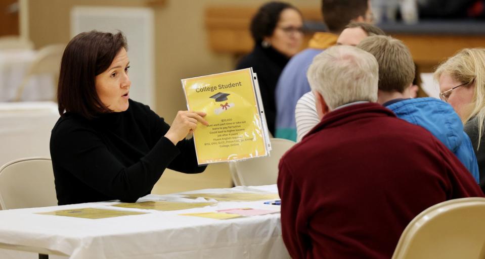 Esther Vasefi talks with Shawn and Denise Pace and their son Matthew as Utah Valley Refugees hosts an "A day in the life of a refugee" event, where families learned more about the refugee resettlement process and how they can offer support to refugees, in Lehi on Friday, March 24, 2023.