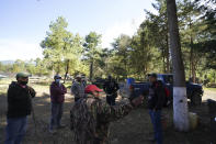 David Ramos Guerrero, a member of the self-governing farmers board, gives instructions before the start of a community patrol through the woods looking for illegal logging and avocado planting, on the outskirts of the Indigenous township of Cheran, Michoacan state, Mexico, Thursday, Jan. 20, 2022. Ramos Guerrero says farmers here have agreed on a total ban on commercial avocado orchards. “People are allowed to have three, four or five, or at most 10 avocado plants to supply food, but commercial planting isn’t allowed.” (AP Photo/Fernando Llano)