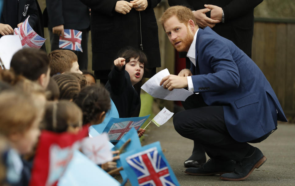 The Duke of Sussex&nbsp;speaks to 6-year-old Stella, a pupil at St. Vincent's Catholic Primary School. (Photo: WPA Pool via Getty Images)