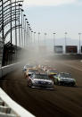 LAS VEGAS, NV - MARCH 11: Dale Earnhardt Jr., driver of the #88 National Guard/Diet Mountain Dew Chevrolet, and Carl Edwards, driver of the #99 Aflac Ford, lead a group of cars during the NASCAR Sprint Cup Series Kobalt Tools 400 at Las Vegas Motor Speedway on March 11, 2012 in Las Vegas, Nevada. (Photo by Todd Warshaw/Getty Images for NASCAR)