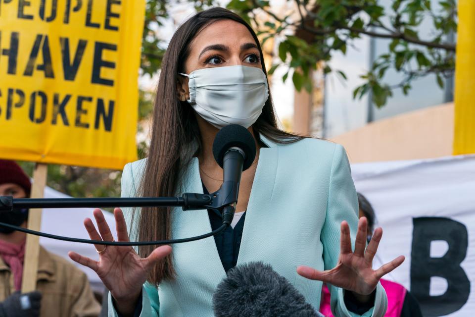 Rep. Alexandria Ocasio-Cortez, D-N.Y., speaks, Thursday, Nov. 19, 2020, outside the Democratic National Committee (DNC) Headquarters in Washington. (AP Photo/Jacquelyn Martin) ORG XMIT: DCJM102