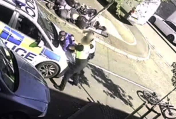 CCTV footage shows the moment West Midlands Police sergeant Jennifer Edwards and PC Declan Jones pinned cyclist Michael Rose against a car during a lockdown stop and search in Birmingham. (Reach)