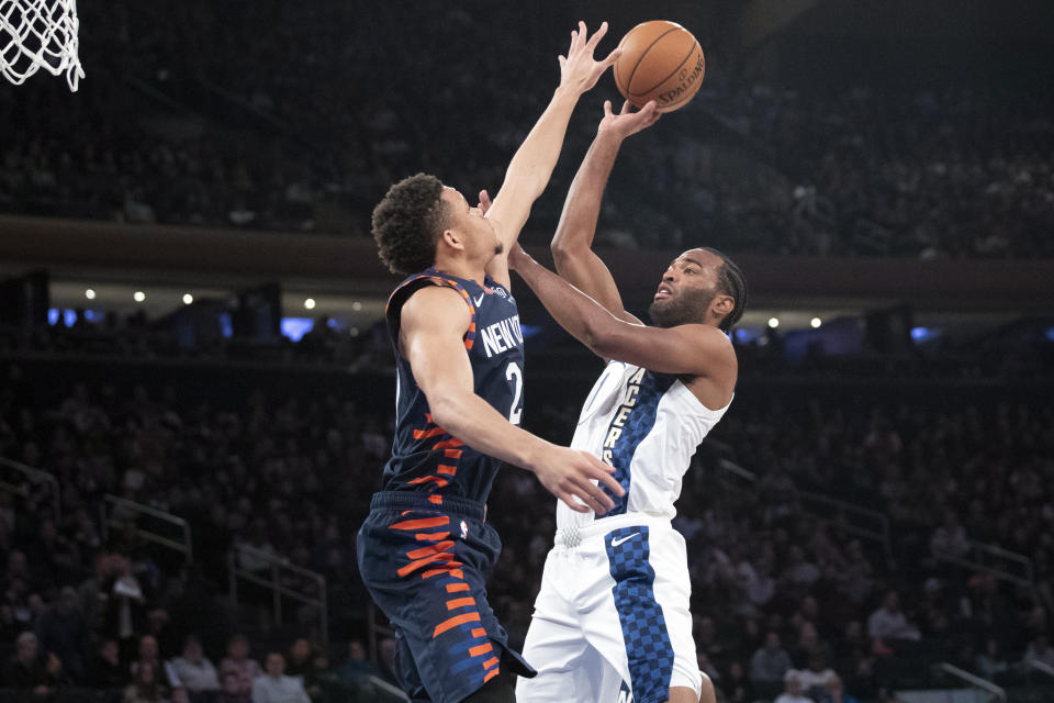 Indiana Pacers forward T.J. Warren (1) goes to the basket against New York Knicks forward Kevin Knox II (20) in the first half of an NBA basketball game, Saturday, Dec. 7, 2019, at Madison Square Garden in New York. (AP Photo/Mary Altaffer)
