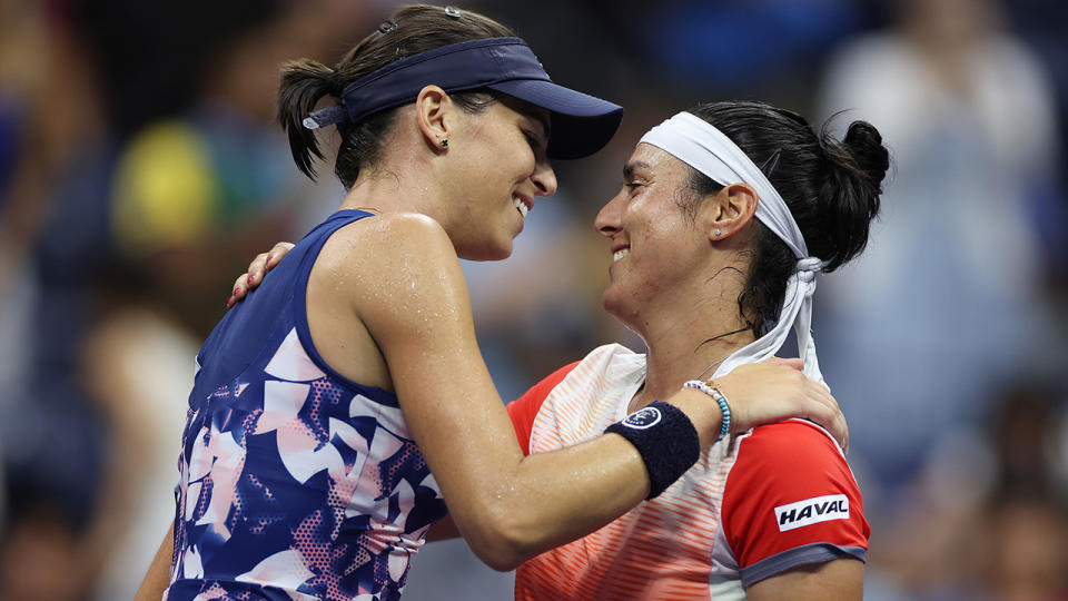 Ajla Tomljanovic and Ons Jabeur embrace aftr their US Open quarter-final.