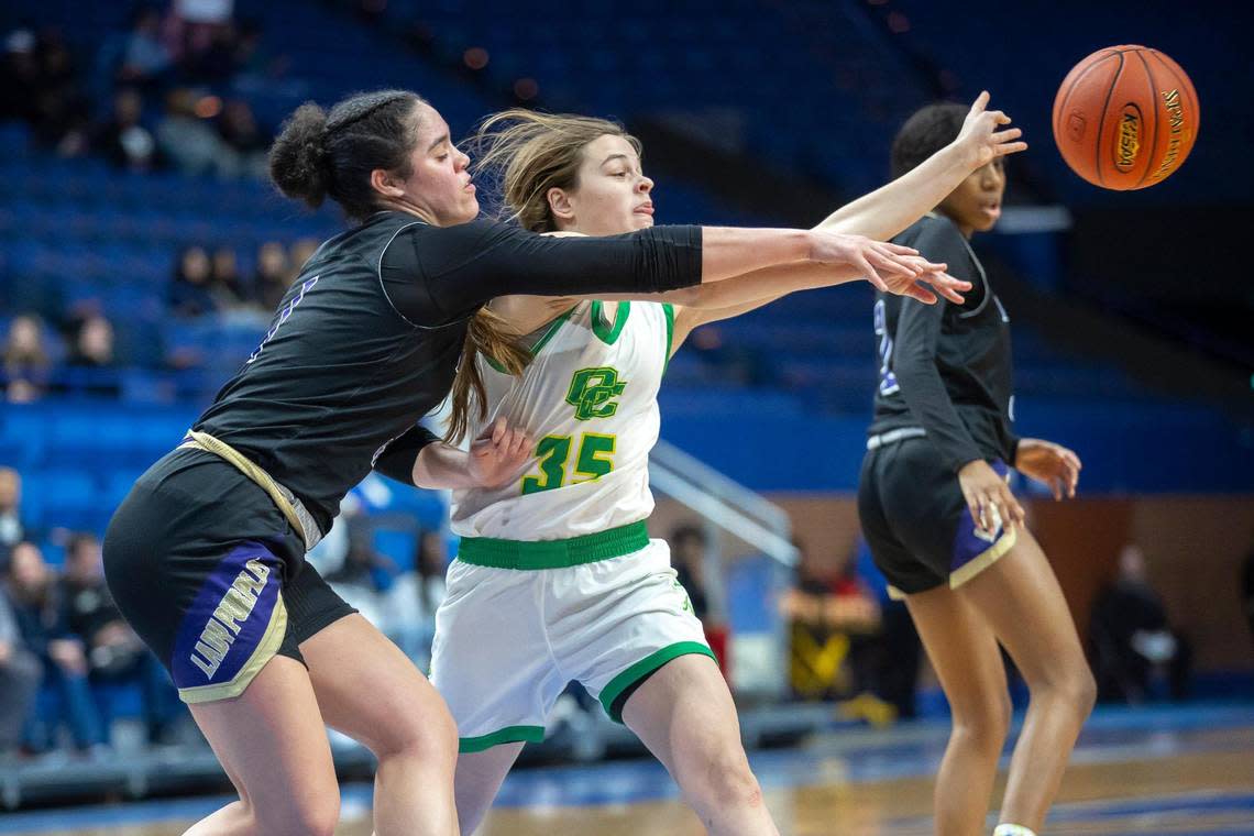 Bowling Green’s Meadow Tisdale (1) and Owensboro Catholic’s Jenna Krampe (35) battled for the ball during Wednesday’s game in Rupp Arena.