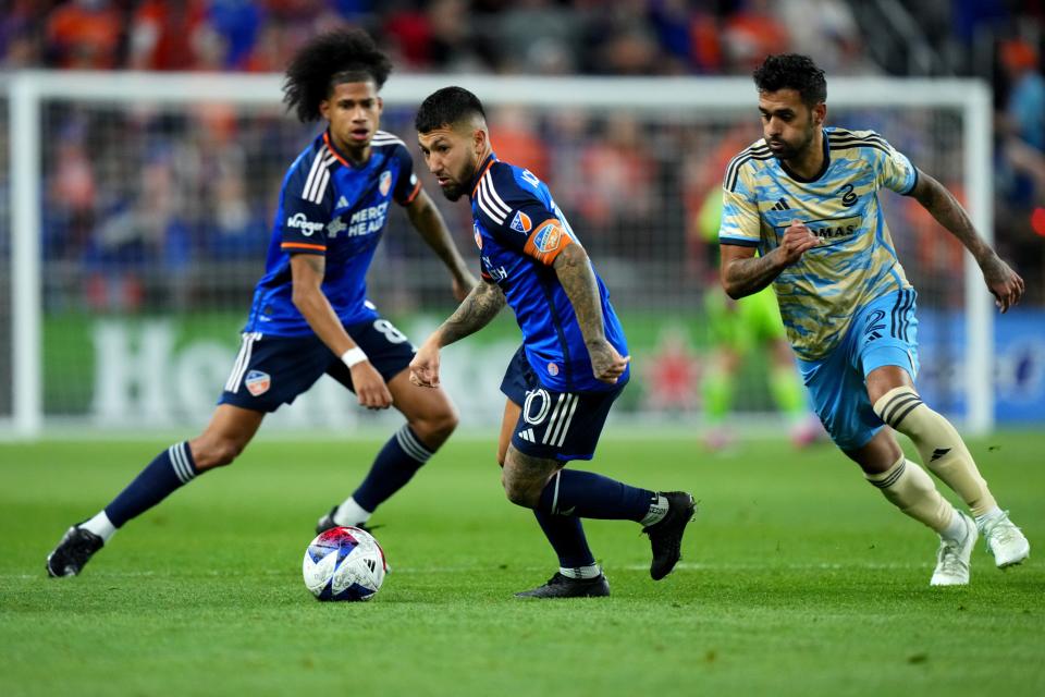 FC Cincinnati midfielder Luciano Acosta (10) changes direction as Philadelphia Union defender Matt Real (2) defends in the second half of an MLS soccer match between FC Cincinnati and Philadelphia Union, Saturday, April 8, 2023, at TQL Stadium in Cincinnati.  FC Cincinnati won, 1-0. 