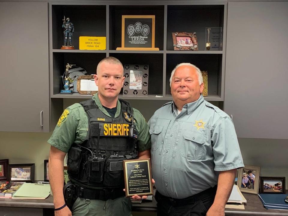 Former Jackson County Sheriff’s Deputy Chad E. Burns, left, is seen in a photo with Lafayette County Sheriff Kerrick Alumbaugh.