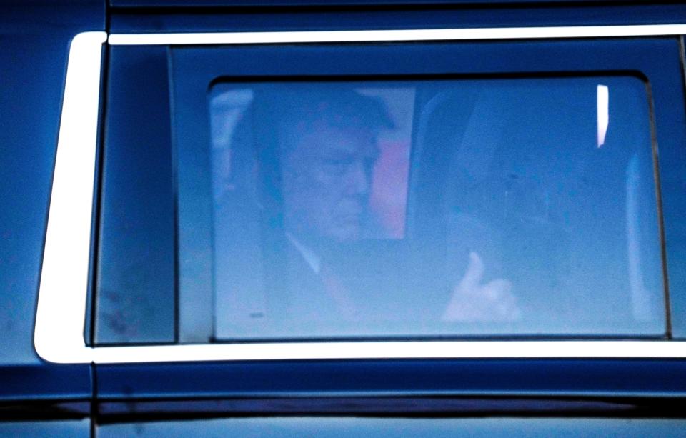 President Donald Trump gives a thumbs up as he departs after surrendering to Atlanta authorities at the Fulton County Jail in Atlanta, Aug. 24, 2023. A grand jury in Fulton County, Georgia indicted former president Donald Trump and 18 other defendants with 41 charges related to tampering with the 2020 election.