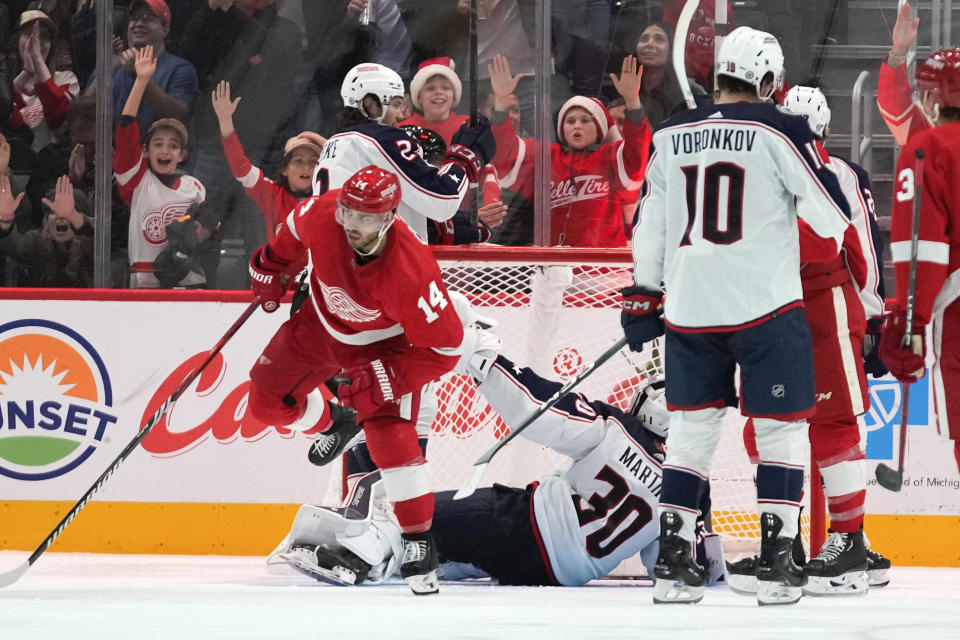 Detroit Red Wings center Robby Fabbri (14) celebrates his goal against the Columbus Blue Jackets in the third period of an NHL hockey game Saturday, Nov. 11, 2023, in Detroit. (AP Photo/Paul Sancya)