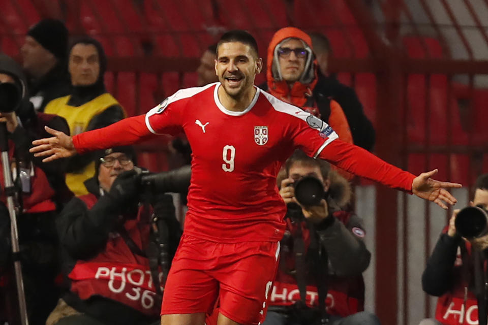 Serbia's Aleksandar Mitrovic celebrates after scoring his side's second goal during the Euro 2020 group B qualifying soccer match between Serbia and Ukraine, on the stadium Rajko Mitic in Belgrade, Serbia, Sunday, Nov. 17, 2019. (AP Photo/Darko Vojinovic)