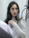 Israeli Naama Issachar stands during an appeal hearings in a courtroom in Moscow, Russia, Thursday, Dec. 19, 2019. An Israeli backpacker serving prison time in Russia on a drug conviction is appealing her case and says she was wasn't provided a translator or lawyer after being detained at a Moscow airport. She was arrested in April in Moscow's Sheremetyevo Airport, where she was transferring flights en route from India to Israel. More than nine grams of hashish were found in her luggage. She was later sentenced to 7 1/2 years. (AP Photo/Alexander Zemlianichenko Jr.)