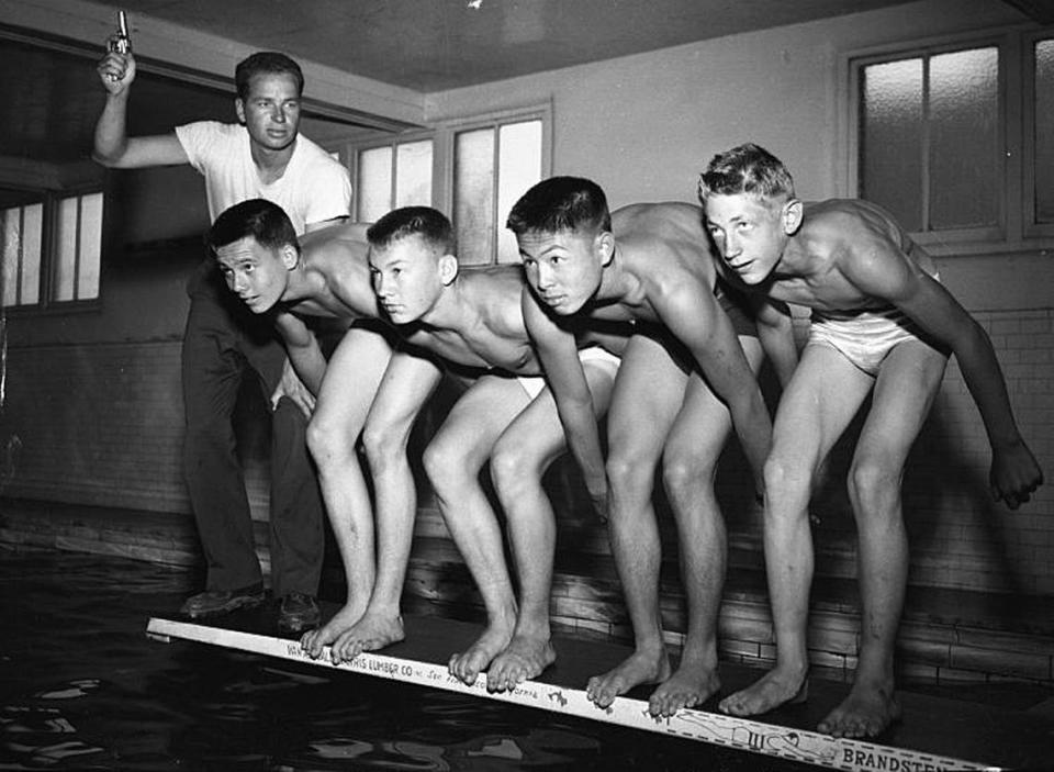 Sacramento YMCA swimming coach Sherm Chavoor, left, poses with Charles McCombe, Bob Mattlia, Tak Iseri and Dick Clare in 1948 after the Far West championships in San Francisco, where Iseri set a record.