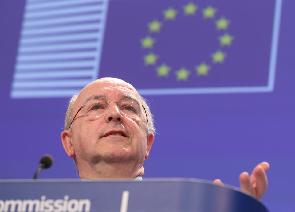 European Commissioner for Competition Joaquin Almunia addresses the media, at the European Commission headquarters in Brussels, Wednesday, Feb. 5, 2014. The European Union's antitrust watchdog says Google is offering new and far-reaching concessions to address allegations it is abusing its dominant position in Internet searches. The EU's executive said Wednesday that Google guarantees it will display results from three competitors in a similar way whenever it promotes its own specialized search services like Google shopping. (AP Photo/Yves Logghe)