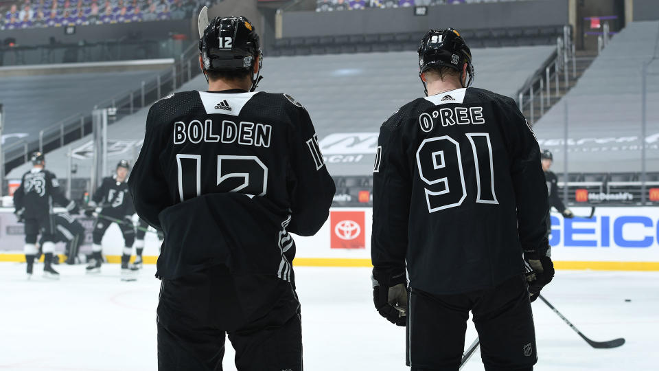 Kings' Trevor Moore and Carl Grundstrom warm up while wearing jerseys honouring Black hockey trailblazers Willie O'Ree and Blake Bolden. (Photo by Andrew D. Bernstein/NHLI via Getty Images)