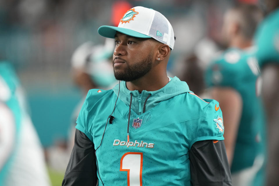 Miami Dolphins quarterback Tua Tagovailoa watches the game from the sidelines during the second half of a pre season NFL football game against the Atlanta Falcons, Friday, Aug. 9, 2024, in Miami Gardens, Fla. (AP Photo/Wilfredo Lee)