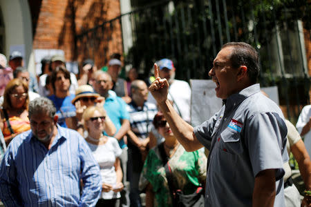 FILE PHOTO: Lawmaker Richard Blanco gives a speech to opposition supporters during a rally against the National Constituent Assembly, outside a school where a polling center will be established for a Constitutional Assembly election next Sunday in Caracas, Venezuela, July 24, 2017. REUTERS/Andres Martinez Casares/File Photo