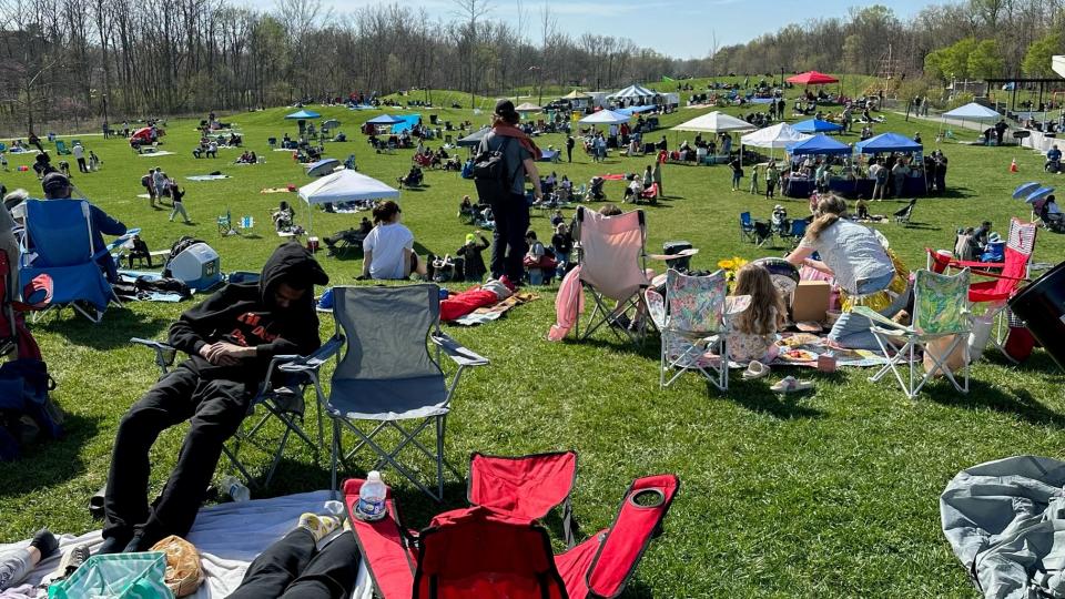 A man naps in Switchyard Park Monday, April 8, 2024, ahead of solar eclipse festivities.