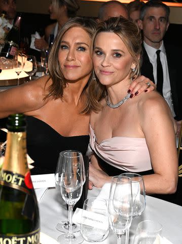 <p>Michael Kovac/Getty</p> Jennifer Aniston and Reese Witherspoon