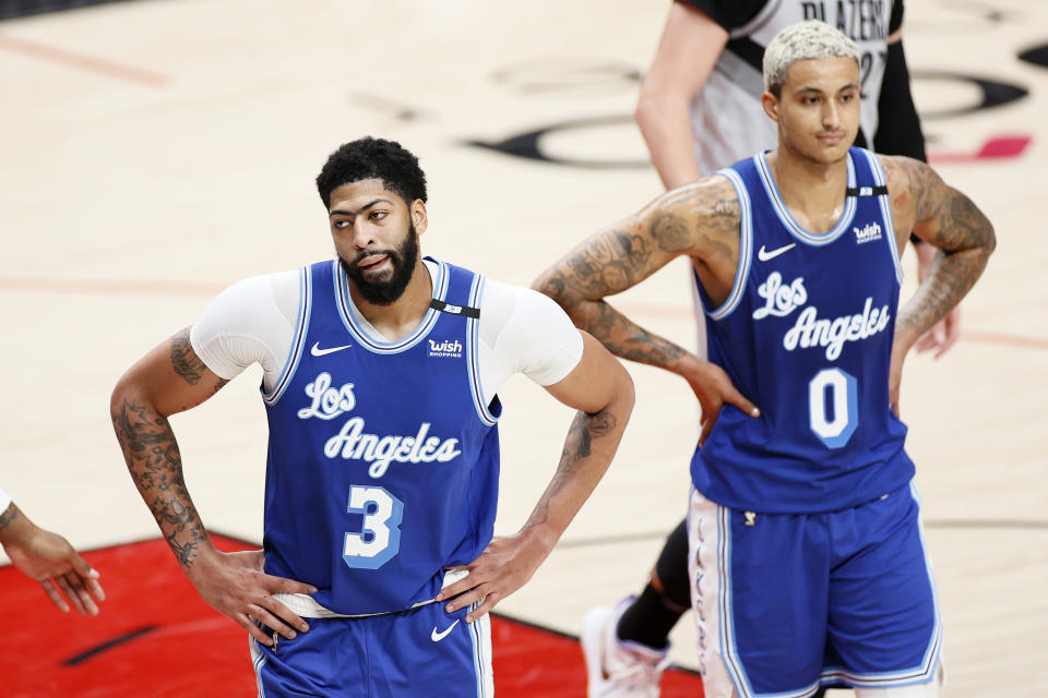 Anthony Davis and Kyle Kuzma of the Los Angeles Lakers react during the third quarter.